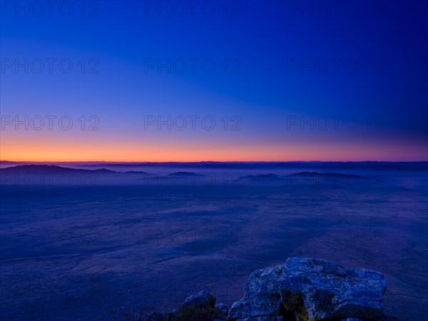 View from a summit to Mongolian steppe at blue hour