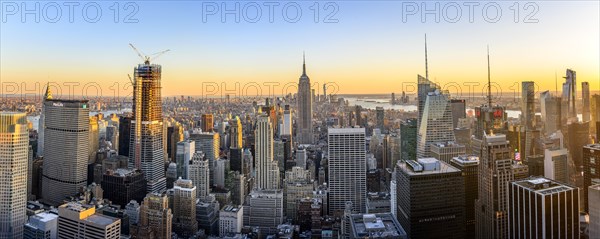 View of Midtown and Downtown Manhattan and Empire State Building from Top of the Rock Observation Center at sunset