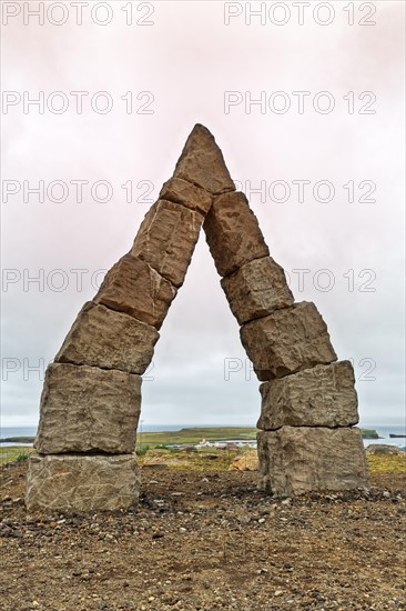 Monumental stone gate in barren landscape