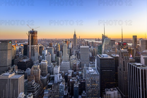 View of Midtown and Downtown Manhattan and Empire State Building from Top of the Rock Observation Center at sunset