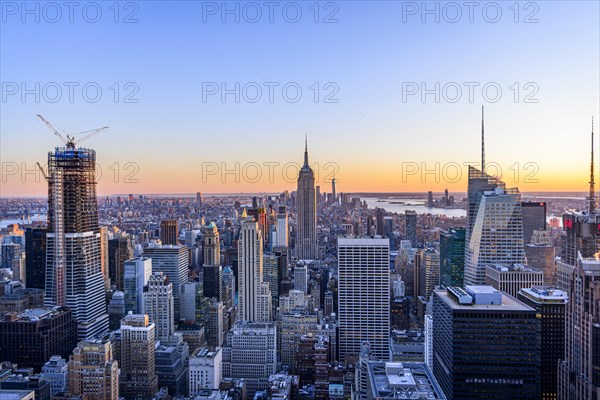 View of Midtown and Downtown Manhattan and Empire State Building from Top of the Rock Observation Center at sunset