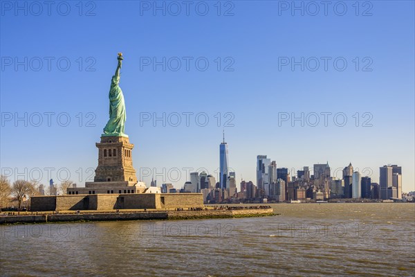 Statue of Liberty in front of Manhattan skyline