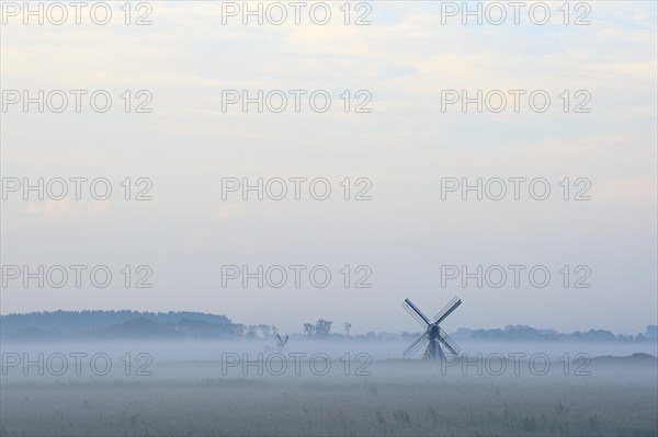 Small windmill with ground fog