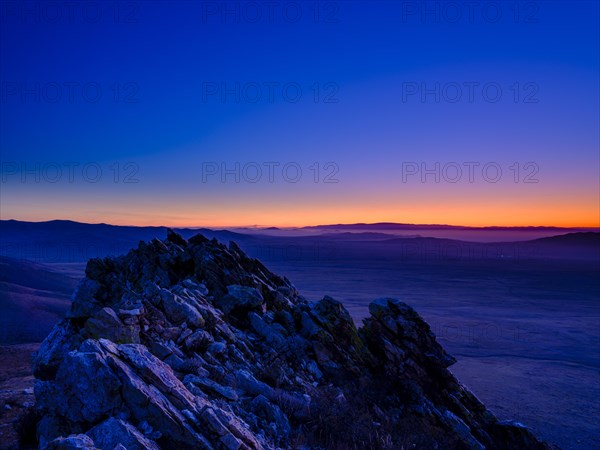 View from a summit to Mongolian steppe at blue hour