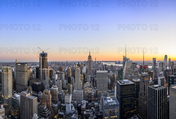 View of Midtown and Downtown Manhattan and Empire State Building from Top of the Rock Observation Center at sunset