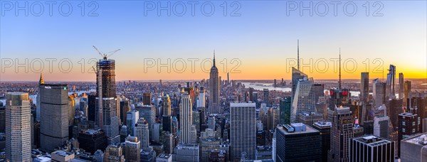 View of Midtown and Downtown Manhattan and Empire State Building from Top of the Rock Observation Center at sunset