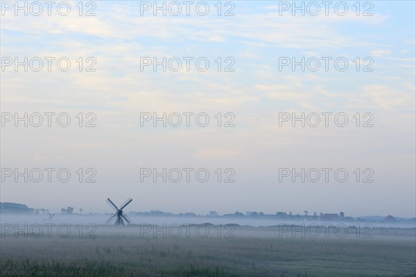 Small windmill with ground fog
