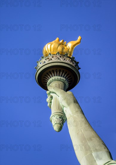 Hand with golden torch