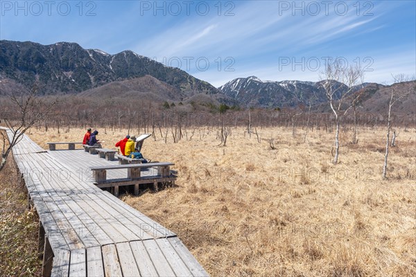 Hikers rest along the hiking trail through the Senjogahara Marsh