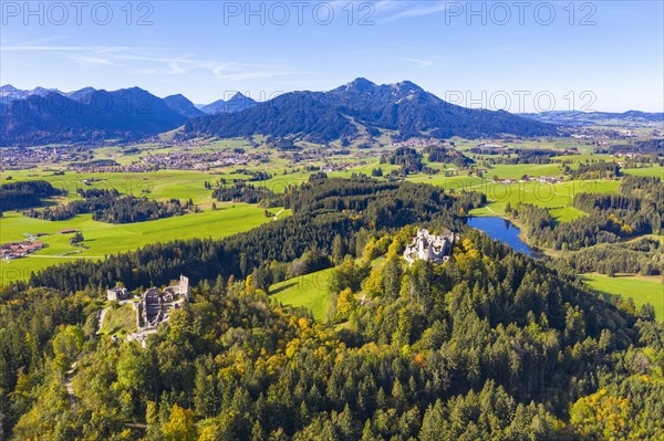 Castle ruins Eisenberg and Hohenfreyberg with Schweinegger castle pond