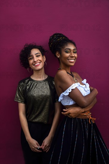 Two smiling young latin women