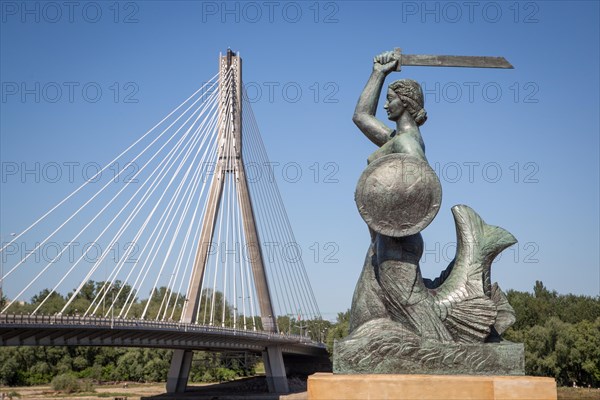 Bronze sculpture of the Warsaw mermaid on the bank of the Vistula River
