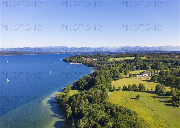 Castle Hohenried and Bernried at Starnberger See with Alpine chain