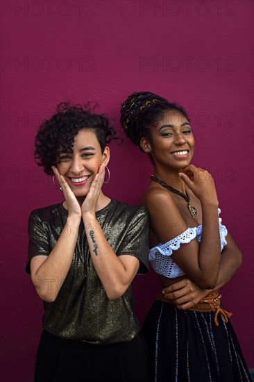 Two smiling young latin women