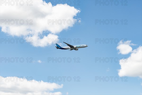Passenger aircraft Airbus A330neo in flight