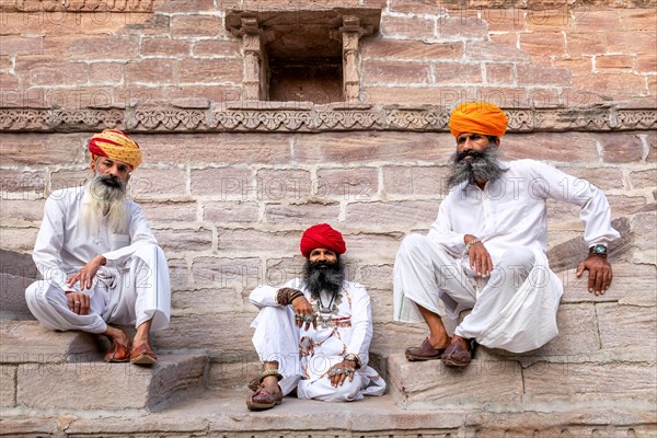 Three men resting at the stepwell Toorji Ka Jhalra in Jodhpur