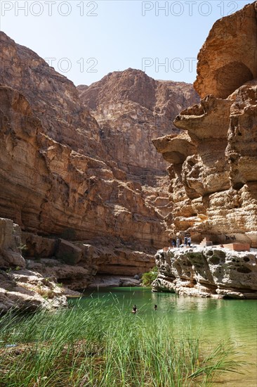 Freshwater pool between rugged cliffs