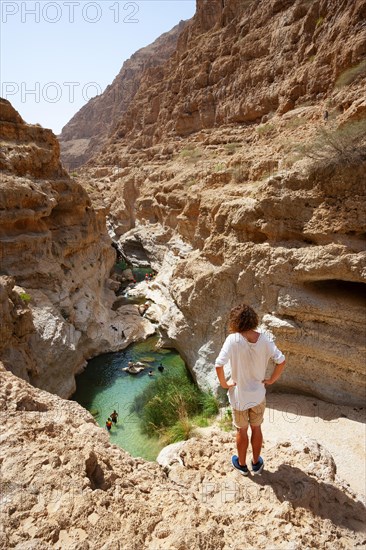 Freshwater pool between rugged cliffs