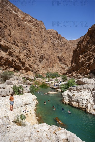 Freshwater pool between rugged cliffs