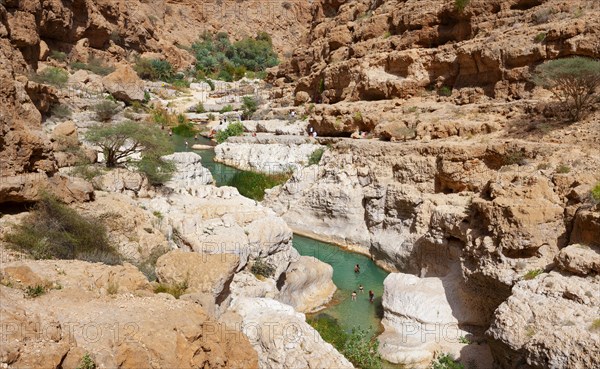 Freshwater pool between rugged cliffs