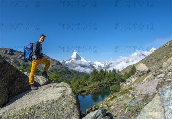 Hiker standing on rocks