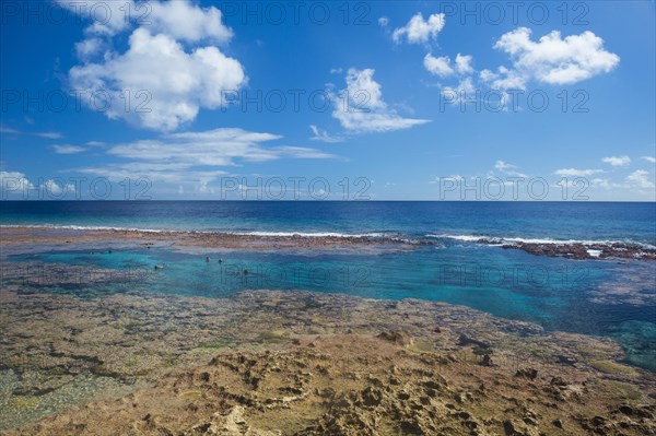 Tourists swimming in the Limu low tide pools