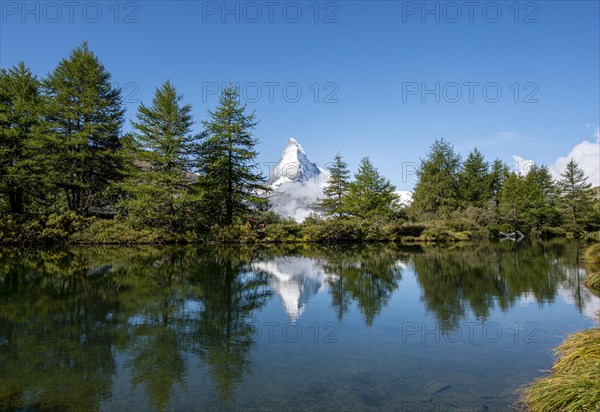 Snow-covered Matterhorn reflected in the lake