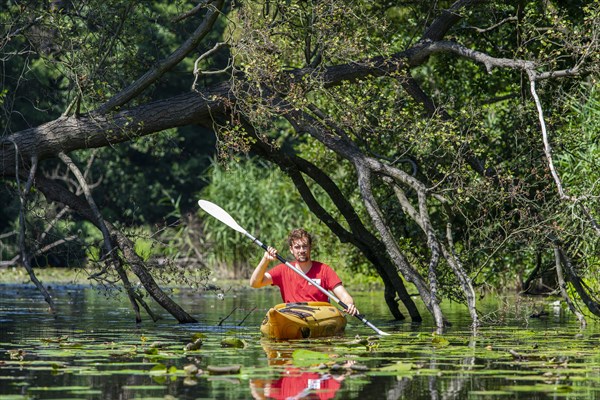 Paddler in a kayak on the Mueggelspree