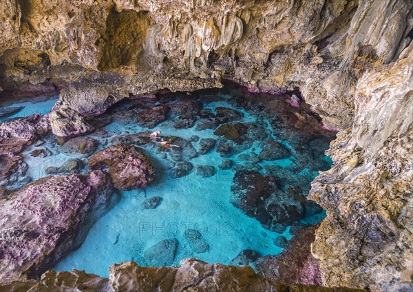 Tourists snorkeling in the Avaiki rock tide pools