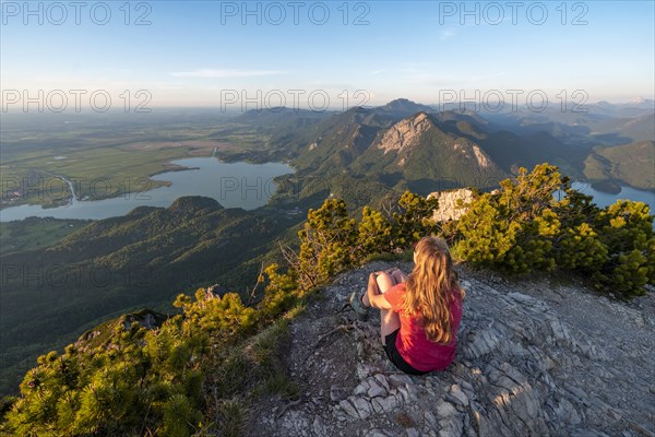 Young woman sitting at the summit