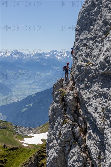 Woman climbing a rock face