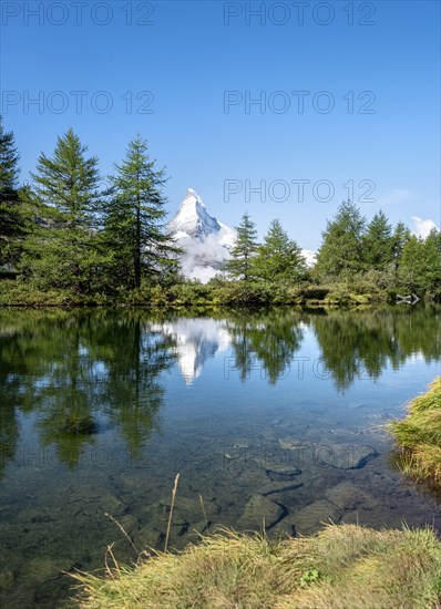 Snow-covered Matterhorn reflected in the lake