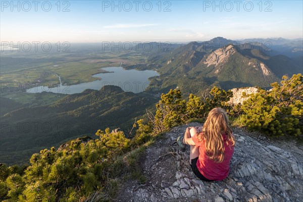 Young woman sitting at the summit