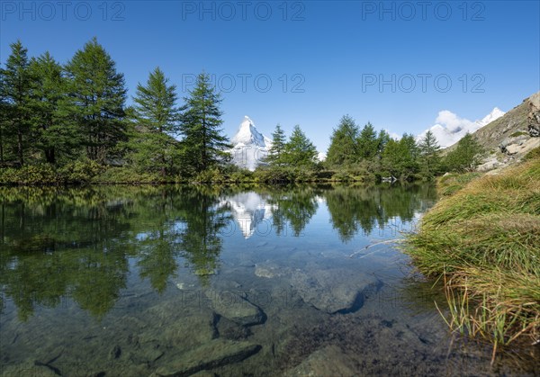 Snow-covered Matterhorn reflected in the lake