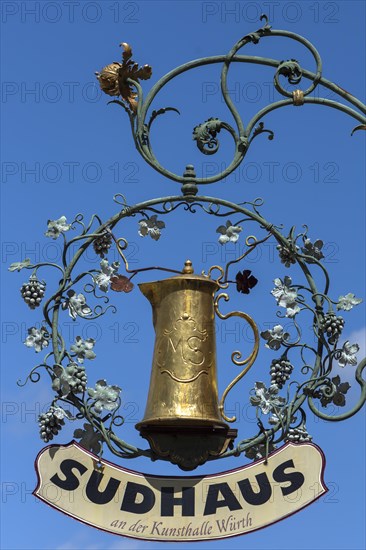 Hanging shop sign with golden beer mug