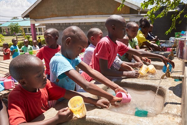 Children washing dishes