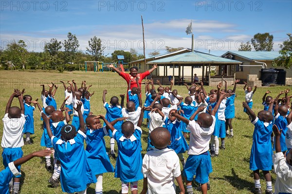 Pupils with teacher in sports class