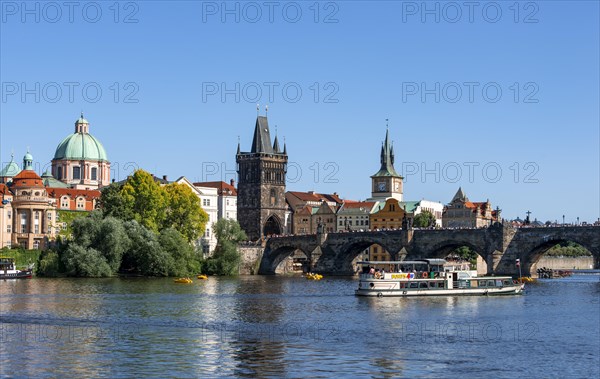 View over the Vltava River to Charles Bridge and Old Town with Kreuzherren Church and Old Town Bridge Tower