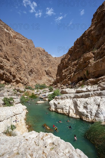 Freshwater pool between rugged cliffs