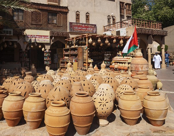 Clay jugs in front of souvenir shops