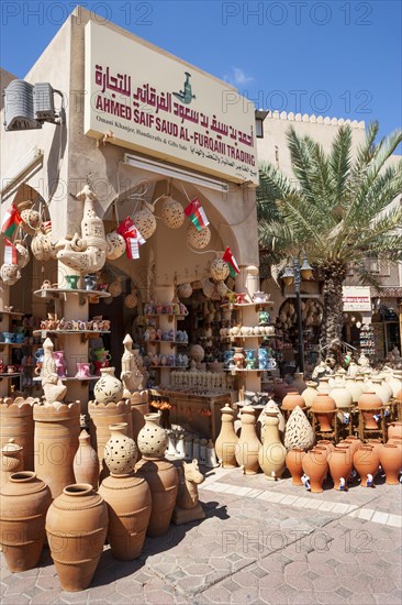 Clay jugs in front of souvenir shop