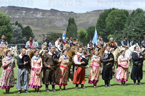 Dance group and riders sing the national anthem at the opening ceremony