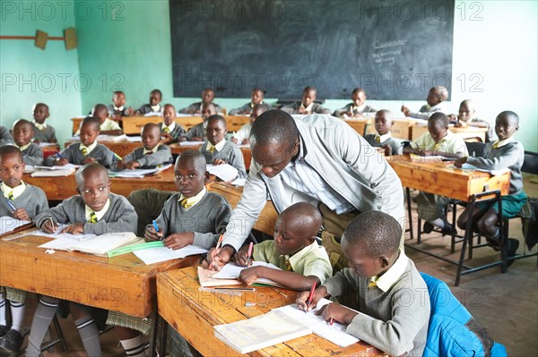 Students with teachers in the classroom teaching at the Primary School