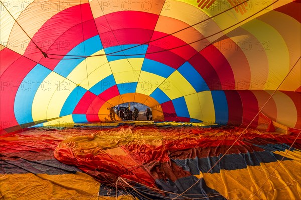 Inside a hot air balloon filling with hot air in preparation for launching