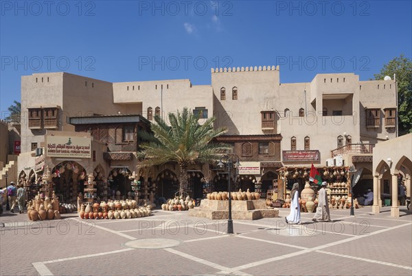 Clay jugs in front of souvenir shops