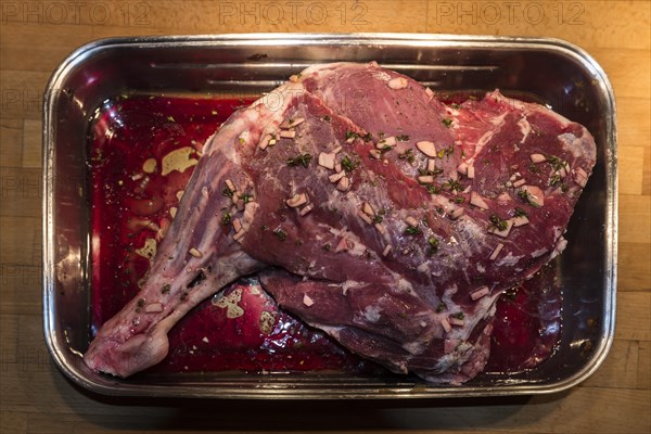 Lamb leg seasoned for frying in a Metal Casserole