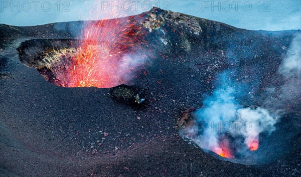 From craters sprays fire and smoke cloud