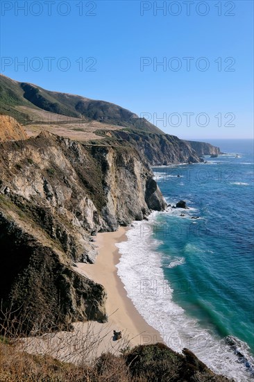 Rocky coast with sandy beach along the California State Route 1