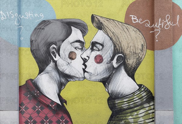 Two gay young men kissing