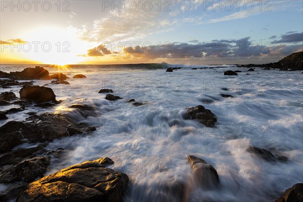 Foaming surf on rocky coast